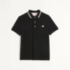 Bawełniana koszulka polo z pikowanym materiałem i naszywką z logo Bawełniana koszulka polo z pikowanym materiałem i naszywką z logo