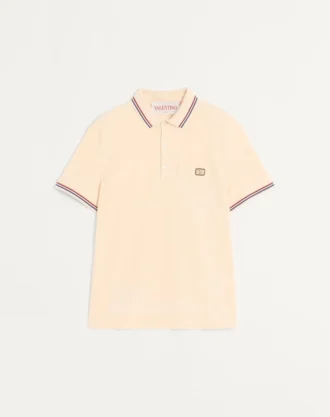 Bawełniana koszulka polo z pikowanym materiałem i naszywką z logo Bawełniana koszulka polo z pikowanym materiałem i naszywką z logo