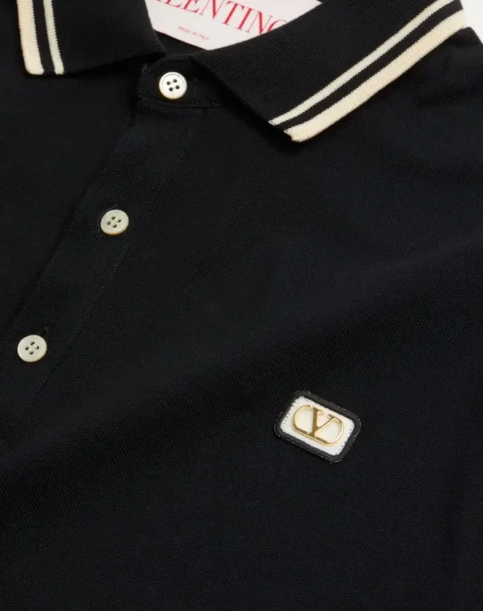 Bawełniana koszulka polo z pikowanym materiałem i naszywką z logo Bawełniana koszulka polo z pikowanym materiałem i naszywką z logo