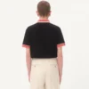 Bawełniana koszulka polo z pikowanym materiałem i naszywką z logo Bawełniana koszulka polo z pikowanym materiałem i naszywką z logo