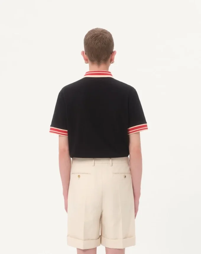 Bawełniana koszulka polo z pikowanym materiałem i naszywką z logo Bawełniana koszulka polo z pikowanym materiałem i naszywką z logo