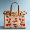 Mała torba na zakupy Valentino Garavani Antibes z raffii żakardowej z wzorem Cherryfic