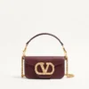 Mała torebka na ramię Valentino Garavani Locò z cielęcej skóry z logo Jewel Mała torebka na ramię Valentino Garavani Locò z cielęcej skóry z logo Jewel