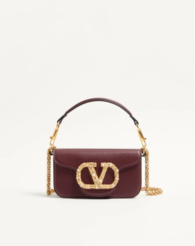 Mała torebka na ramię Valentino Garavani Locò z cielęcej skóry z logo Jewel Mała torebka na ramię Valentino Garavani Locò z cielęcej skóry z logo Jewel