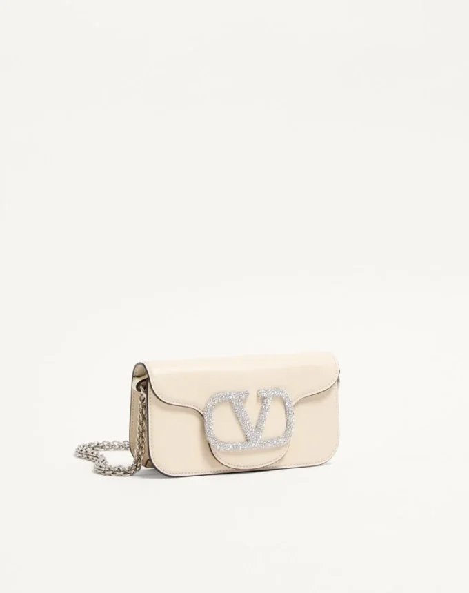 Mała torebka na ramię Valentino Garavani Locò z logo Jewel Mała torebka na ramię Valentino Garavani Locò z logo Jewel