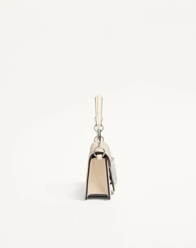 Mała torebka na ramię Valentino Garavani Locò z logo Jewel Mała torebka na ramię Valentino Garavani Locò z logo Jewel