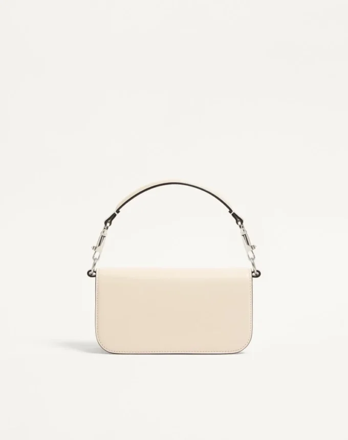 Mała torebka na ramię Valentino Garavani Locò z logo Jewel Mała torebka na ramię Valentino Garavani Locò z logo Jewel