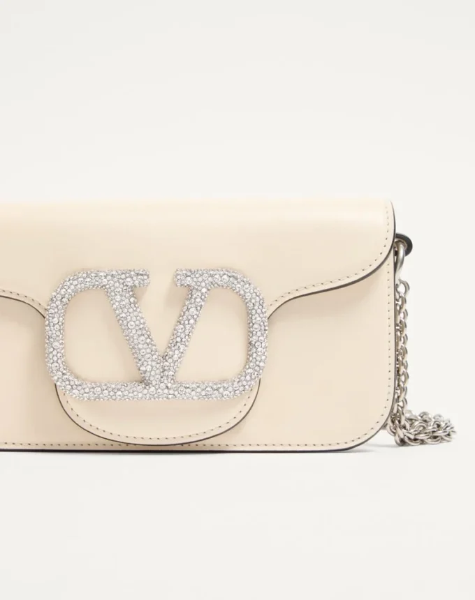 Mała torebka na ramię Valentino Garavani Locò z logo Jewel Mała torebka na ramię Valentino Garavani Locò z logo Jewel