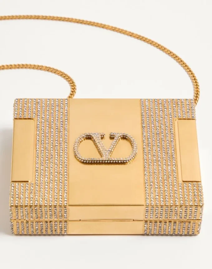 Metalowa kopertówka Minaumorphe Minaudière marki Valentino Garavani z kryształami Swarovski® i satynowym etui Metalowa kopertówka Minaumorphe Minaudière marki Valentino Garavani z kryształami Swarovski® i satynowym etui
