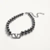 Metalowy naszyjnik Vlogo Signature z perłami Swarovski®