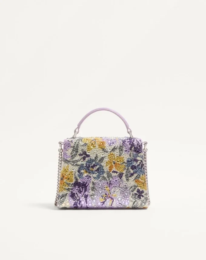 Mini torebka Valentino Garavani Vsling z motywem Flowerism z kryształków i logo z klejnotami Mini torebka Valentino Garavani Vsling z motywem Flowerism z kryształków i logo z klejnotami
