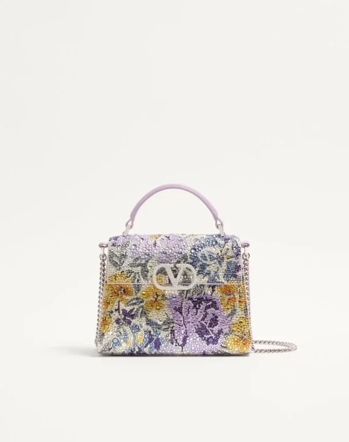 Mini torebka Valentino Garavani Vsling z motywem Flowerism z kryształków i logo z klejnotami Mini torebka Valentino Garavani Vsling z motywem Flowerism z kryształków i logo z klejnotami