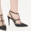 Szpilki Rockstud z chropowatej skóry z paskiem wokół kostki 100 mm Szpilki Rockstud z chropowatej skóry z paskiem wokół kostki 100 mm