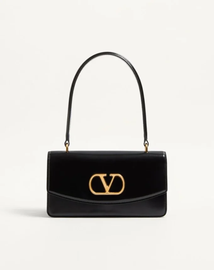 Torba Valentino Garavani Vain z uchwytem z błyszczącej skóry cielęcej Torba Valentino Garavani Vain z uchwytem z błyszczącej skóry cielęcej