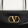 Torba Valentino Garavani Vain z uchwytem z błyszczącej skóry cielęcej Torba Valentino Garavani Vain z uchwytem z błyszczącej skóry cielęcej