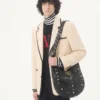 Wełniany sweter Valentino z wysokim kołnierzem i naszywką z logo V Wełniany sweter Valentino z wysokim kołnierzem i naszywką z logo V