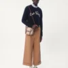 Wełniany sweter z okrągłym dekoltem i haftem Chez Valentino Wełniany sweter z okrągłym dekoltem i haftem Chez Valentino