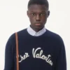 Wełniany sweter z okrągłym dekoltem i haftem Chez Valentino Wełniany sweter z okrągłym dekoltem i haftem Chez Valentino